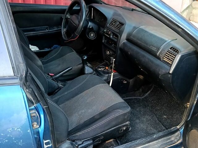 Синий Мазда 323, объемом двигателя 1.5 л и пробегом 350 тыс. км за 1500 $, фото 4 на Automoto.ua