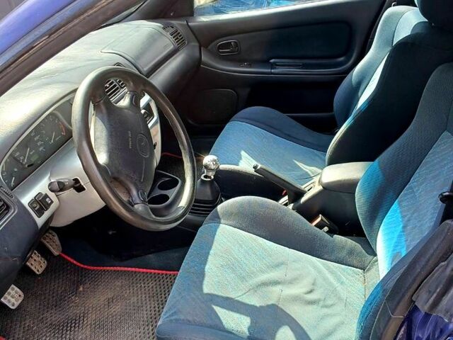 Синий Мазда 323, объемом двигателя 1.5 л и пробегом 300 тыс. км за 2500 $, фото 3 на Automoto.ua