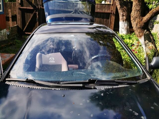 Синий Мазда 323, объемом двигателя 1.5 л и пробегом 300 тыс. км за 2850 $, фото 2 на Automoto.ua