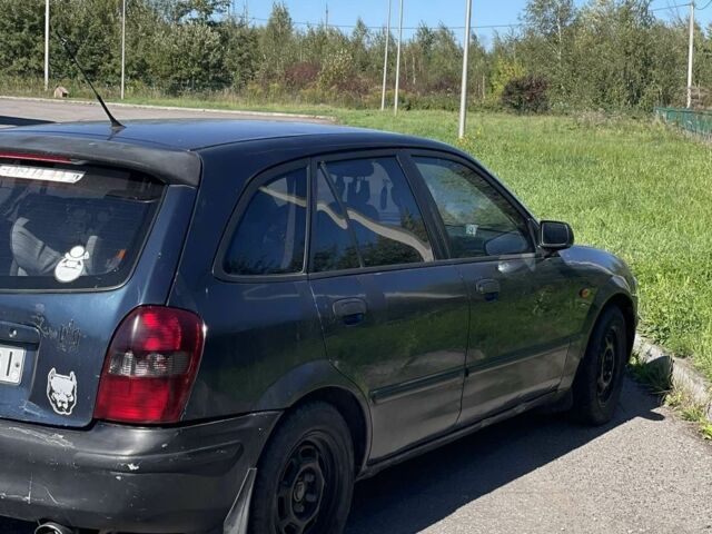 Синий Мазда 323, объемом двигателя 2 л и пробегом 240 тыс. км за 2500 $, фото 1 на Automoto.ua