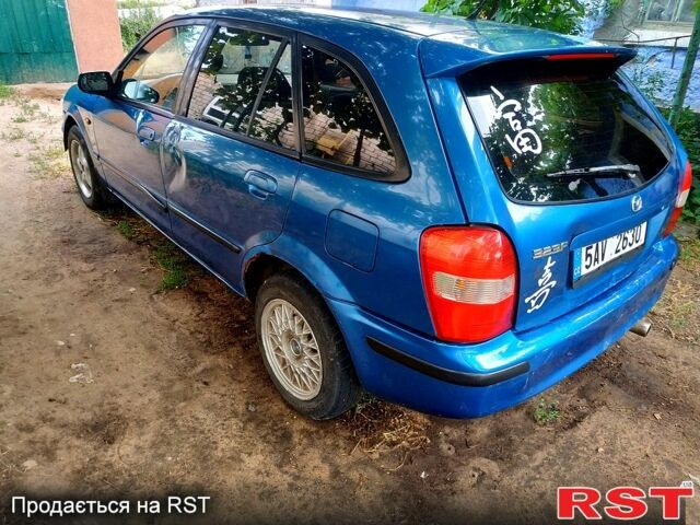 Синій Мазда 323, об'ємом двигуна 1.5 л та пробігом 300 тис. км за 550 $, фото 3 на Automoto.ua
