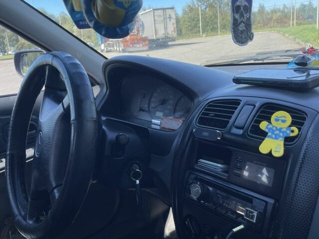 Синий Мазда 323, объемом двигателя 2 л и пробегом 240 тыс. км за 2500 $, фото 4 на Automoto.ua