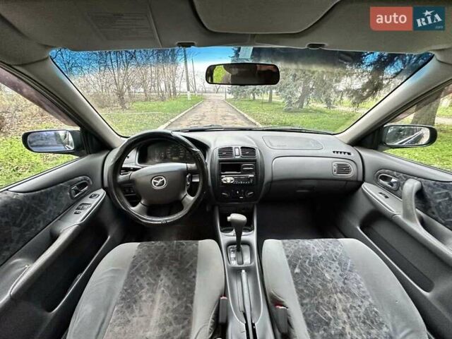 Синий Мазда 323, объемом двигателя 1.5 л и пробегом 315 тыс. км за 2400 $, фото 7 на Automoto.ua