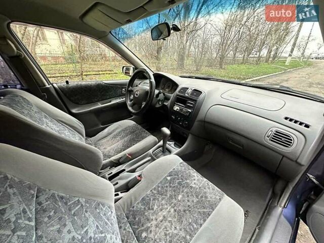 Синий Мазда 323, объемом двигателя 1.5 л и пробегом 315 тыс. км за 2400 $, фото 11 на Automoto.ua