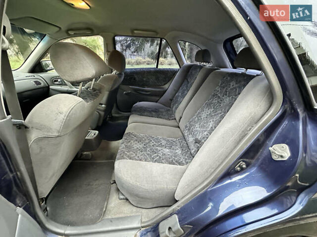 Синий Мазда 323, объемом двигателя 1.5 л и пробегом 315 тыс. км за 2400 $, фото 9 на Automoto.ua