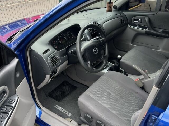 Синій Мазда 323, об'ємом двигуна 1.6 л та пробігом 172 тис. км за 3600 $, фото 9 на Automoto.ua