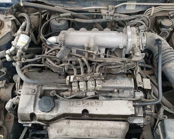 Синій Мазда 323, об'ємом двигуна 1.5 л та пробігом 410 тис. км за 1800 $, фото 2 на Automoto.ua