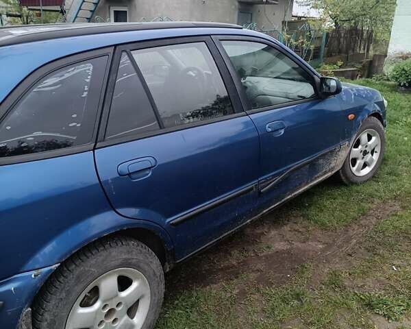 Синій Мазда 323, об'ємом двигуна 1.5 л та пробігом 410 тис. км за 1800 $, фото 8 на Automoto.ua