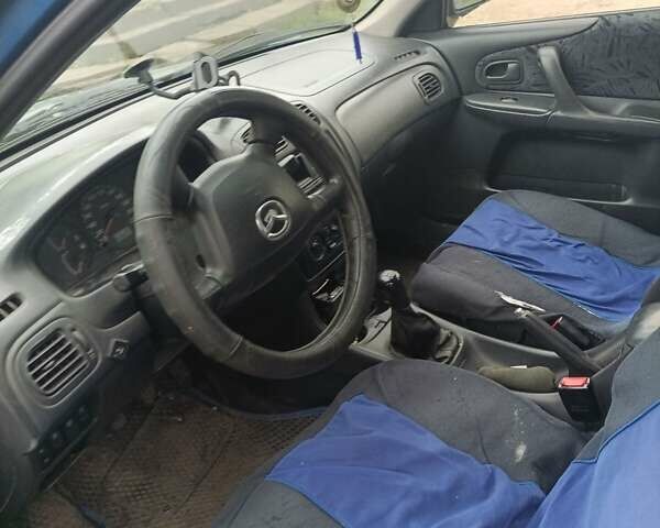 Синій Мазда 323, об'ємом двигуна 1.5 л та пробігом 410 тис. км за 1800 $, фото 12 на Automoto.ua