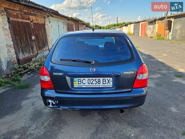 Синий Мазда 323, объемом двигателя 1.8 л и пробегом 238 тыс. км за 2400 $, фото 4 на Automoto.ua