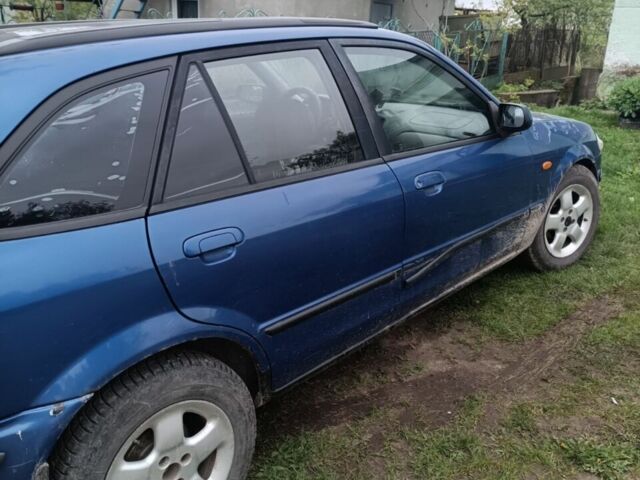 Синій Мазда 323, об'ємом двигуна 1.5 л та пробігом 410 тис. км за 1800 $, фото 8 на Automoto.ua