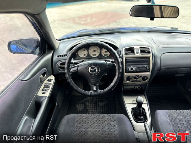 Синий Мазда 323, объемом двигателя 2 л и пробегом 300 тыс. км за 3000 $, фото 11 на Automoto.ua