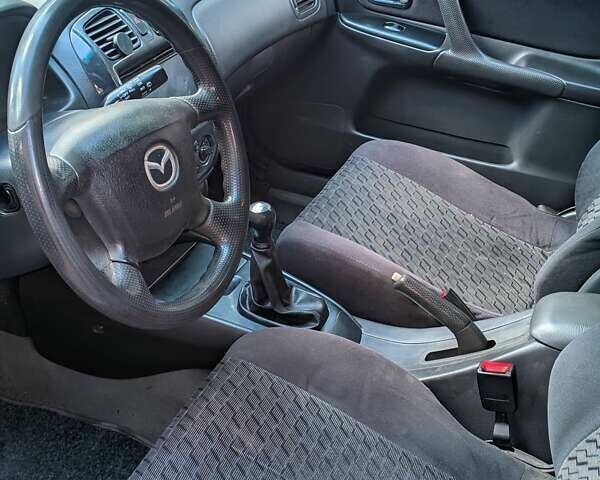 Синий Мазда 323, объемом двигателя 1.6 л и пробегом 407 тыс. км за 3200 $, фото 11 на Automoto.ua