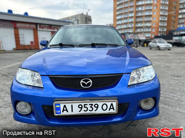 Синий Мазда 323, объемом двигателя 2 л и пробегом 300 тыс. км за 3000 $, фото 2 на Automoto.ua