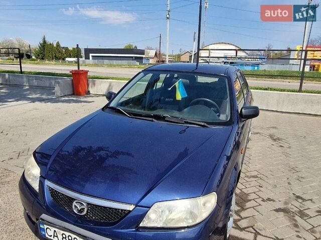 Синий Мазда 323, объемом двигателя 1.99 л и пробегом 288 тыс. км за 2600 $, фото 3 на Automoto.ua