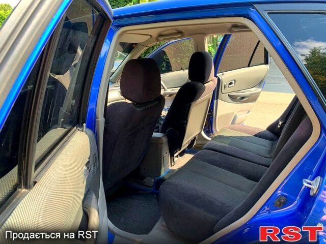 Синій Мазда 323, об'ємом двигуна 1.6 л та пробігом 270 тис. км за 3000 $, фото 7 на Automoto.ua