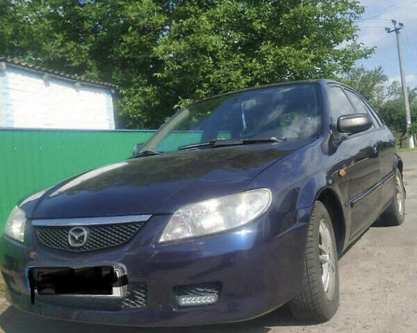 Синій Мазда 323, об'ємом двигуна 2 л та пробігом 350 тис. км за 3100 $, фото 2 на Automoto.ua