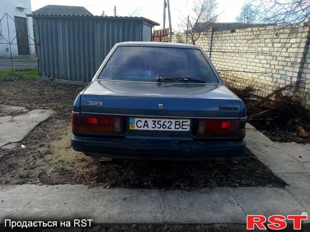 Синий Мазда 323, объемом двигателя 1.3 л и пробегом 0 тыс. км за 250 $, фото 2 на Automoto.ua