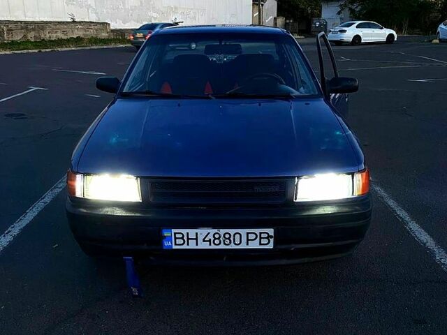 Синій Мазда 323, об'ємом двигуна 1.3 л та пробігом 0 тис. км за 1200 $, фото 1 на Automoto.ua