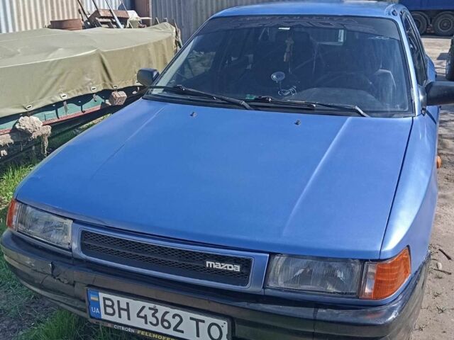 Синій Мазда 323, об'ємом двигуна 1.3 л та пробігом 322 тис. км за 1000 $, фото 3 на Automoto.ua
