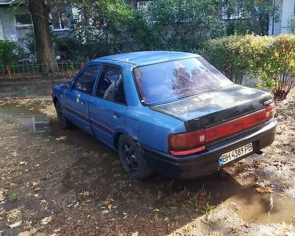 Синий Мазда 323, объемом двигателя 1.7 л и пробегом 350 тыс. км за 850 $, фото 5 на Automoto.ua