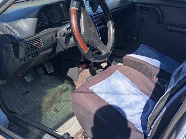 Синій Мазда 323, об'ємом двигуна 1.3 л та пробігом 322 тис. км за 1000 $, фото 6 на Automoto.ua