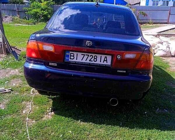 Синий Мазда 323, объемом двигателя 1.3 л и пробегом 429 тыс. км за 2100 $, фото 1 на Automoto.ua