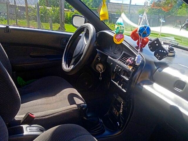 Синий Мазда 323, объемом двигателя 1.3 л и пробегом 429 тыс. км за 2100 $, фото 4 на Automoto.ua