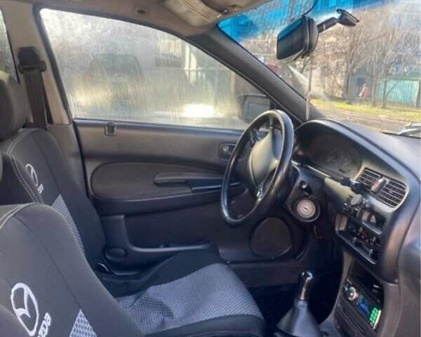 Синій Мазда 323, об'ємом двигуна 1.5 л та пробігом 478 тис. км за 1900 $, фото 1 на Automoto.ua