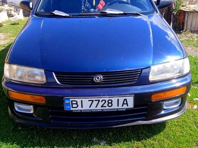 Синий Мазда 323, объемом двигателя 1.3 л и пробегом 429 тыс. км за 2100 $, фото 1 на Automoto.ua