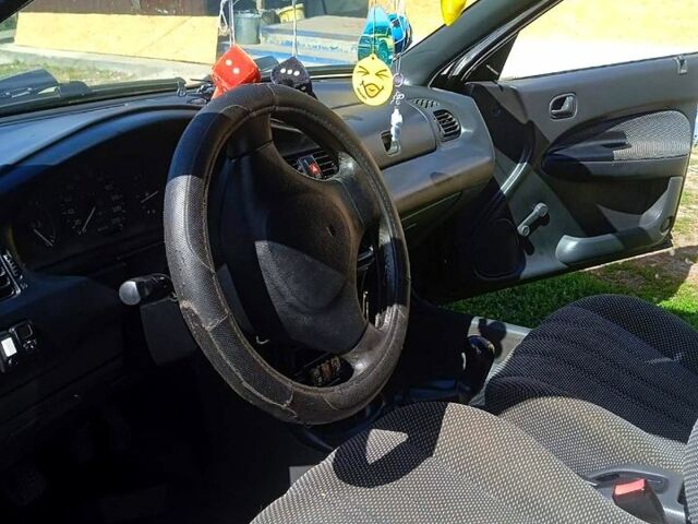 Синий Мазда 323, объемом двигателя 1.3 л и пробегом 429 тыс. км за 2100 $, фото 3 на Automoto.ua