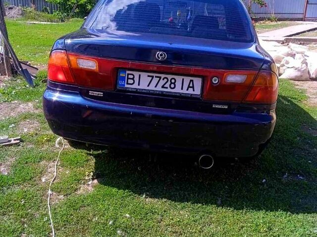 Синий Мазда 323, объемом двигателя 1.3 л и пробегом 429 тыс. км за 2100 $, фото 2 на Automoto.ua