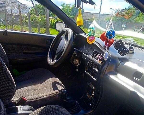 Синий Мазда 323, объемом двигателя 1.3 л и пробегом 429 тыс. км за 2100 $, фото 3 на Automoto.ua