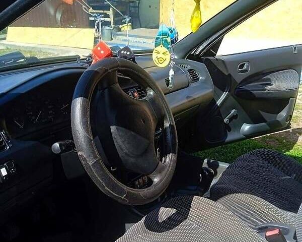 Синий Мазда 323, объемом двигателя 1.3 л и пробегом 429 тыс. км за 2100 $, фото 2 на Automoto.ua