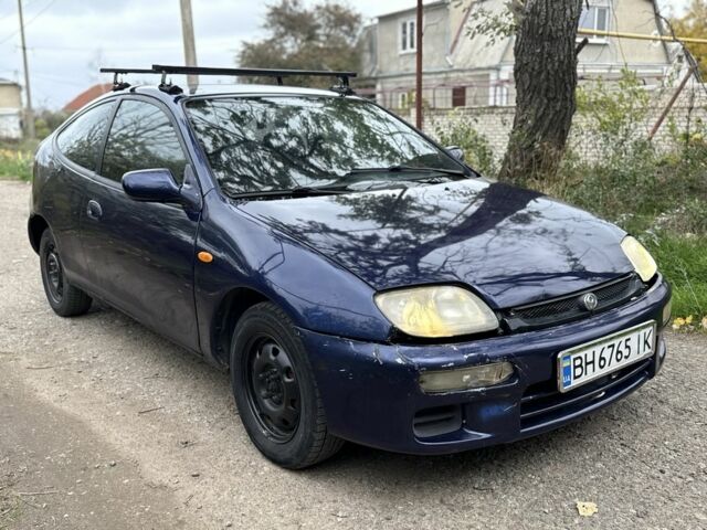 Синій Мазда 323, об'ємом двигуна 1.5 л та пробігом 200 тис. км за 1000 $, фото 1 на Automoto.ua