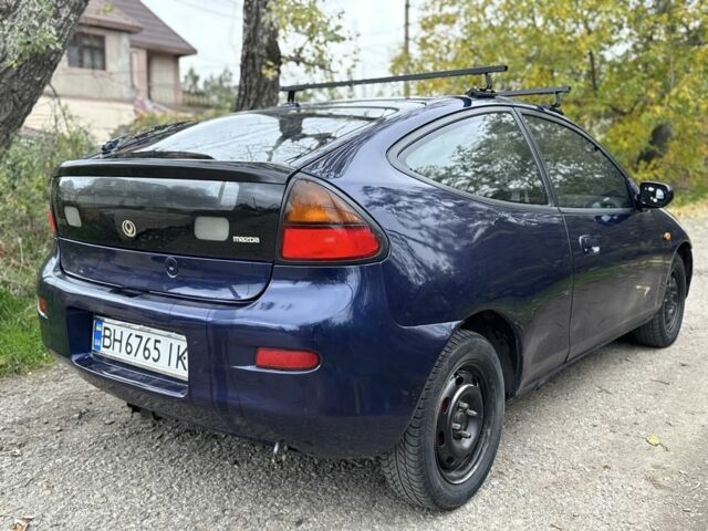 Синій Мазда 323, об'ємом двигуна 1.5 л та пробігом 200 тис. км за 1000 $, фото 2 на Automoto.ua