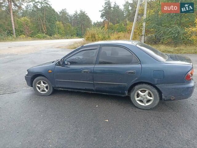 Синий Мазда 323, объемом двигателя 1.49 л и пробегом 250 тыс. км за 1450 $, фото 4 на Automoto.ua