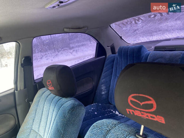 Синий Мазда 323, объемом двигателя 1.5 л и пробегом 250 тыс. км за 999 $, фото 7 на Automoto.ua