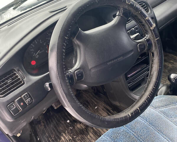 Синий Мазда 323, объемом двигателя 1.5 л и пробегом 250 тыс. км за 999 $, фото 6 на Automoto.ua