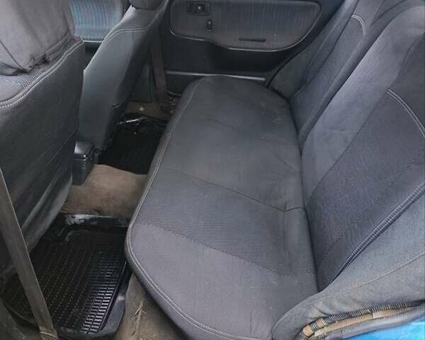 Синий Мазда 323, объемом двигателя 1.69 л и пробегом 250 тыс. км за 750 $, фото 3 на Automoto.ua