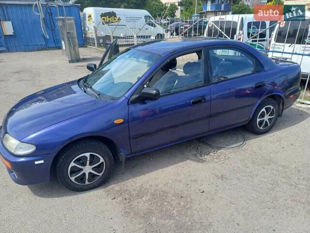 Синий Мазда 323, объемом двигателя 1.5 л и пробегом 295 тыс. км за 2300 $, фото 19 на Automoto.ua