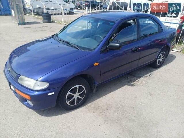 Синий Мазда 323, объемом двигателя 1.5 л и пробегом 295 тыс. км за 2300 $, фото 5 на Automoto.ua
