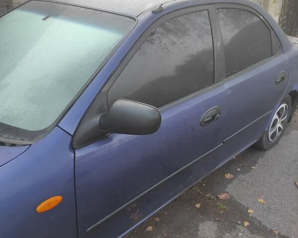 Синий Мазда 323, объемом двигателя 1.5 л и пробегом 295 тыс. км за 2300 $, фото 2 на Automoto.ua