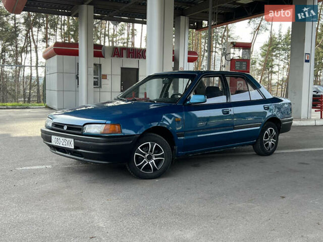 Синий Мазда 323, объемом двигателя 1.6 л и пробегом 250 тыс. км за 1900 $, фото 1 на Automoto.ua