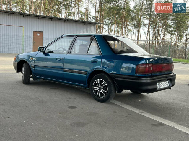 Синий Мазда 323, объемом двигателя 1.6 л и пробегом 250 тыс. км за 1900 $, фото 2 на Automoto.ua