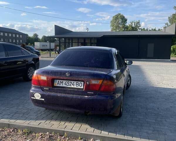 Синий Мазда 323, объемом двигателя 1.5 л и пробегом 380 тыс. км за 1400 $, фото 3 на Automoto.ua