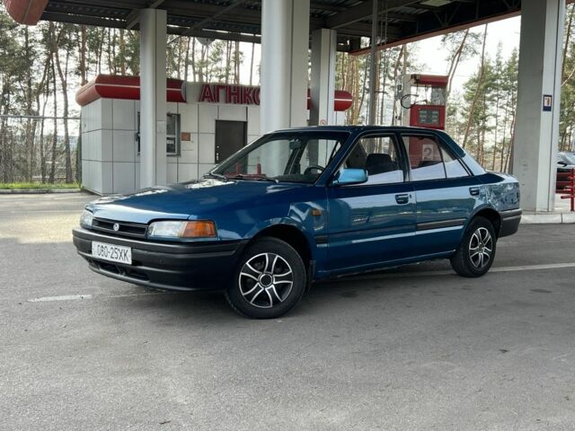 Синий Мазда 323, объемом двигателя 1.6 л и пробегом 250 тыс. км за 1900 $, фото 1 на Automoto.ua