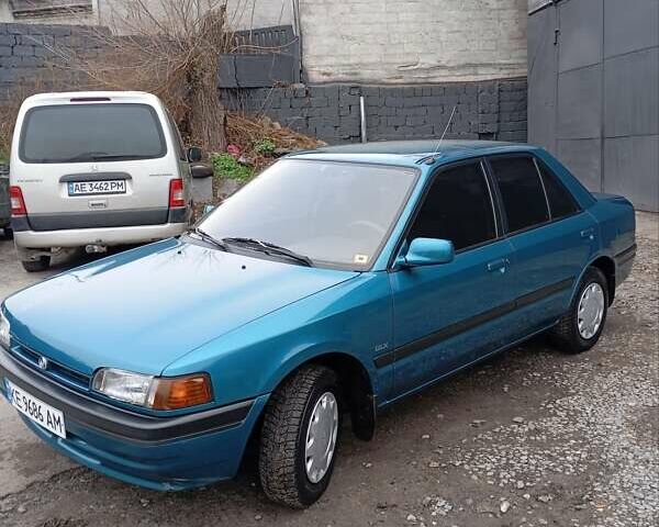 Синий Мазда 323, объемом двигателя 1.6 л и пробегом 159 тыс. км за 3000 $, фото 1 на Automoto.ua