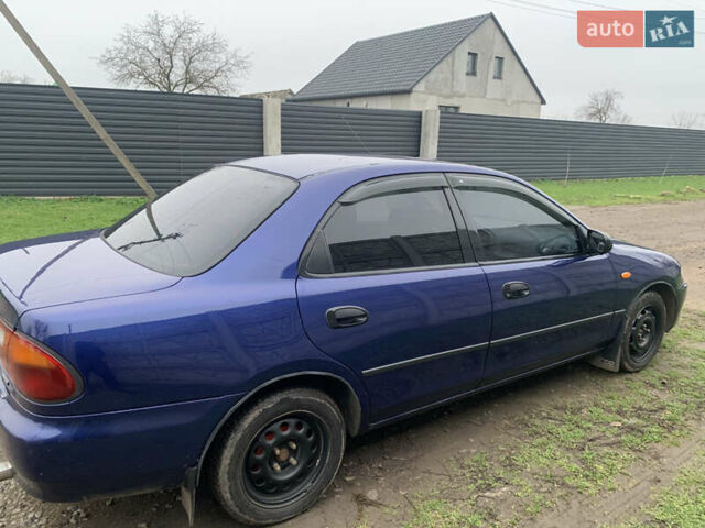 Синій Мазда 323, об'ємом двигуна 1.5 л та пробігом 419 тис. км за 1700 $, фото 7 на Automoto.ua