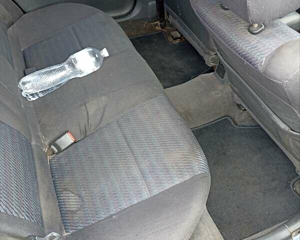 Синий Мазда 323, объемом двигателя 1.49 л и пробегом 250 тыс. км за 1450 $, фото 2 на Automoto.ua